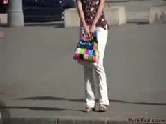 Tanya removes her damp clothes and urinates in her underwear.